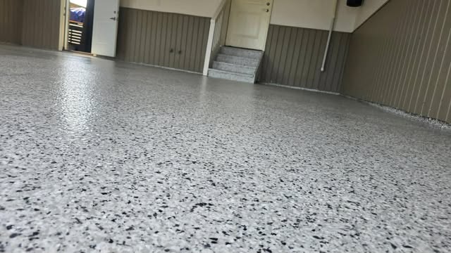 Grey flake epoxy garage floor with coated steps