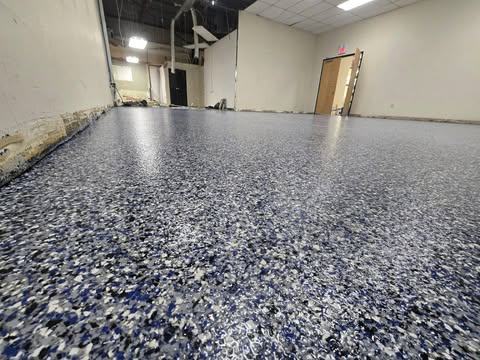 Blue and white flake epoxy floor in a commercial space