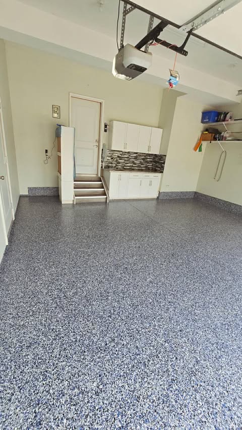 Blue flake epoxy floor in a residential garage