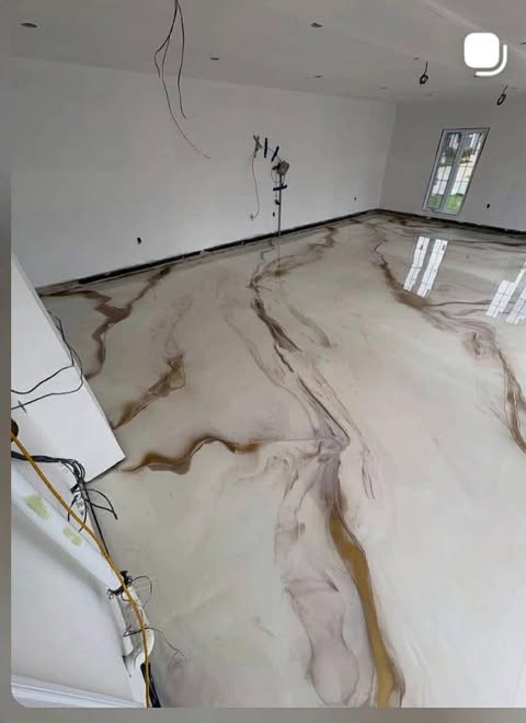 Metallic epoxy floor with marble-style veining